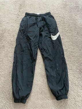 Nike Black Unisex Windbreaker Joggers with White Swoosh Accent
